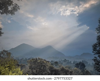Sun Rays Breaking Through Clouds Over Mountain Forest Landscape


Dramatic sun rays shining through dense clouds above a mountain forest landscape, creating a serene and atmospheric natural scene with misty hills, lush vegetation, and a scenic mountain backdrop.
