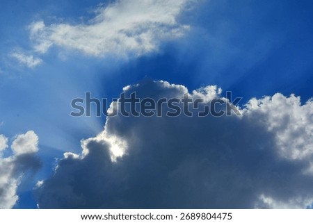Sun rays breaking through the clouds of a dramatic stormy sky Israel