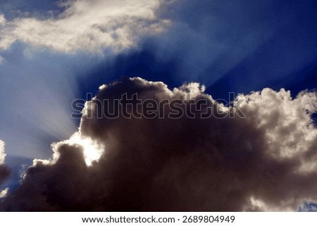 Sun rays breaking through the clouds of a dramatic stormy sky Israel