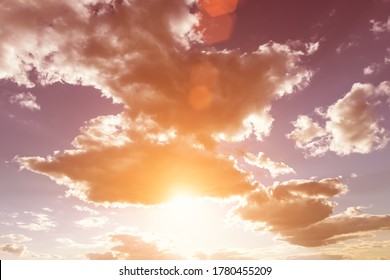 Sun rays breaking through cumulus clouds. The concept of divine light, a glimmer of hope or overcoming difficulties. Spiritual religious abstract background.