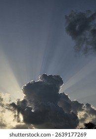 Sun Rays Breaking Through Dramatic Storm Clouds at Dusk