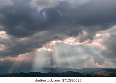 Dramatic Sunrise With Sun Rays Through Storm Clouds Over Misty Hills ...
