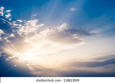 Sun Rays Bursting Through The Clouds.