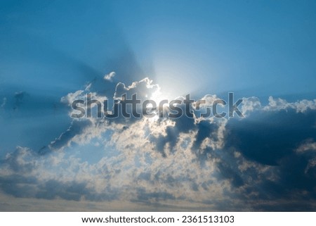 Sun rays bursting through clouds. Beautiful beam of light and the clouds. The divine sky.