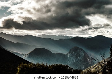 Sun rays lighting through the clouds in high Pyrenees, France