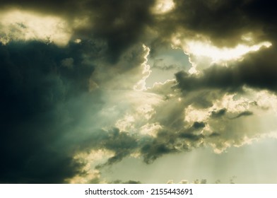 Sun Rays On Dark Sky, Background Or Wallpaper. Amazing Sky Window. Dramatic Heaven.