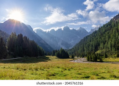 Sun rays over the mountain valley