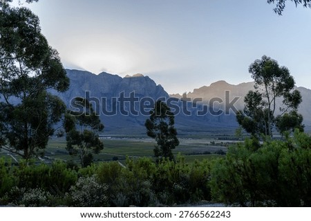 Sun rays peeping through a mountain range