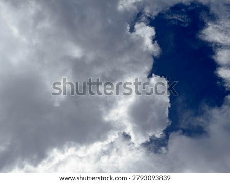 Sun rays piercing through cloud formations, inspiring nature background, vibrant atmospheric photography captured in detailed quality.
