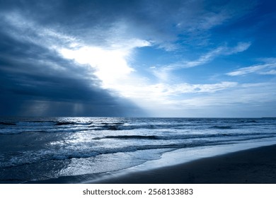 Sun rays piercing through rainy clouds 