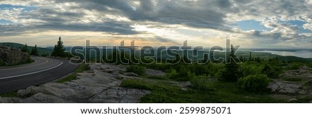Sun Rays Shine Over Acadia Coastline and Scenic Drive at Sunset