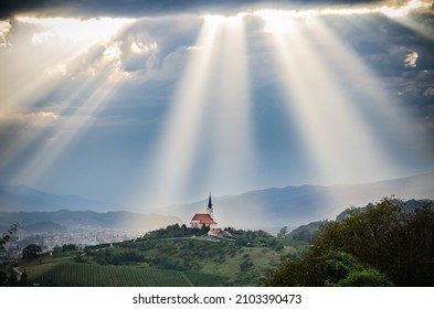 Sun rays shining down on a Church - Powered by Shutterstock