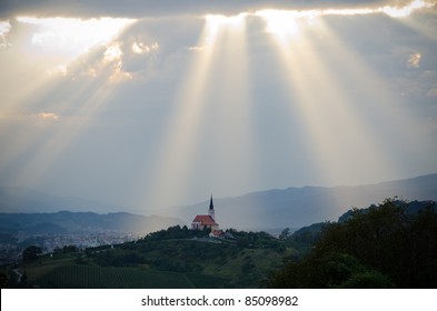 Sun rays shining down on a Church