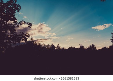 Sun rays shining through the clouds, Italy