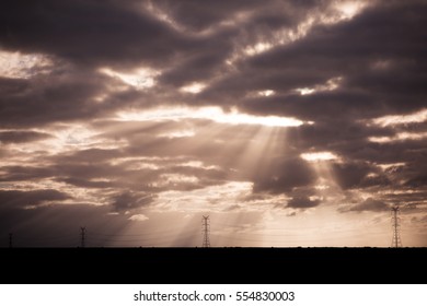 Sun Rays Shining Through Clouds at Sunset