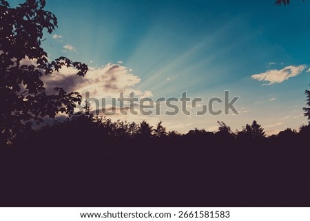 Sun rays shining through the clouds, Italy