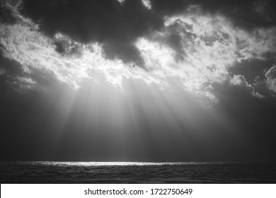 Sun rays in a stormy see landscape