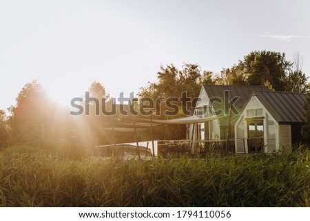 sun rays sunset on the house by the water private zone eco tourism outside cleanliness nature backyard and river