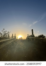Sun rays from the sunset poking through the desert. 