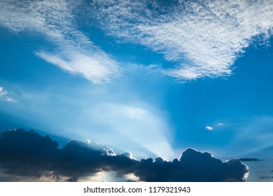 Sun rays through clouds like an dramatic explosion , power nature background.