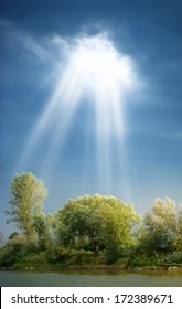 Sun Rays Through Clouds Shine Meadow With  Trees