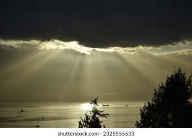 Sun rays through dark clouds