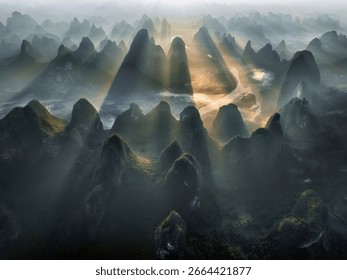 Sun Rays Through Forested Peaks Above River in Guilin China Aerial View