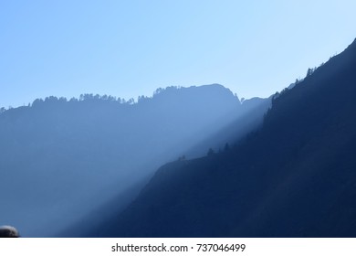 Sun Rays Through Mountains
