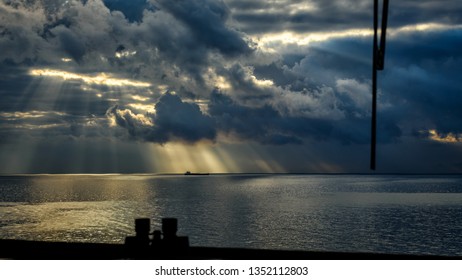 Sun rays view from navigation bridge window of super tanker