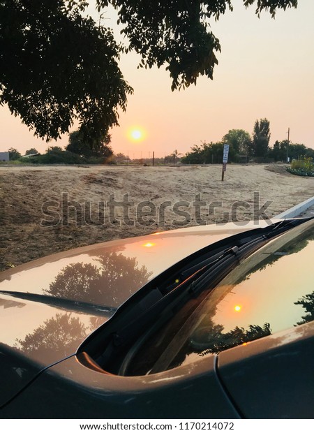 Sun Reflections on Car\
Hood