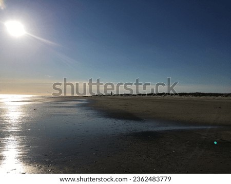 Sun reflexion on the endless beach of Denmark