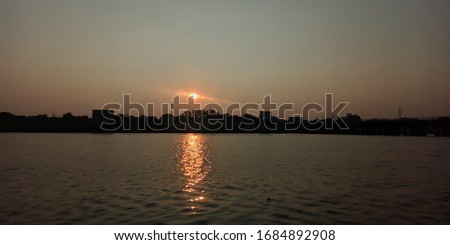 sun rise reflecting in river