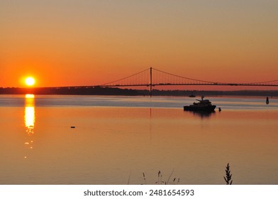 Sun Rises Behind The Bridge