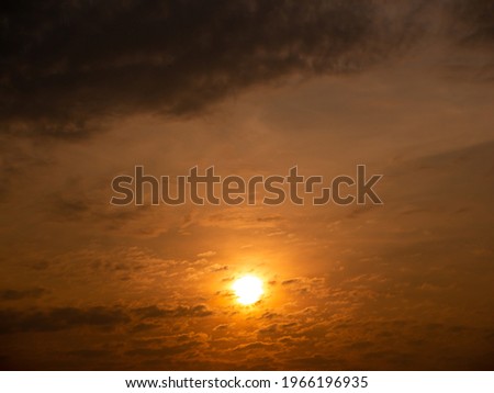 The Sun Rises Below The Picture on a Cloudy Day in Yellow Background