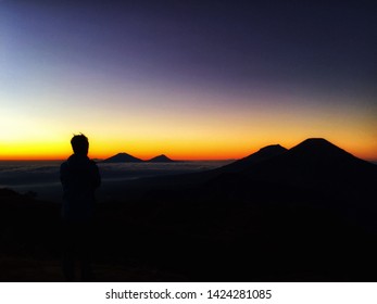 
the sun rises from the mountains