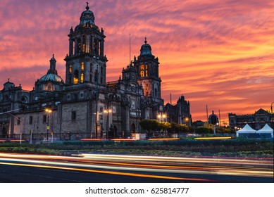 The sun rises over the Mexico City Metropolitan Cathedral in the Zocalo Square of Mexico City, Mexico.