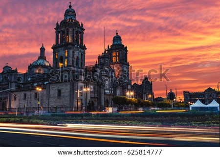 The sun rises over the Mexico City Metropolitan Cathedral in the Zocalo Square of Mexico City, Mexico.