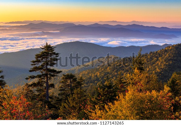The sun rises\
over the Smoky Mountains at Clingman\'s Dome in Great Smoky\
Mountains National Park,\
Tennessee