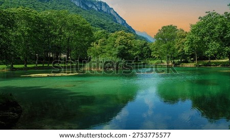 the sun rises in spring on the small lake in the wild forest