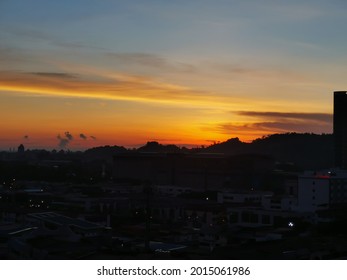 Sun Rising From Behind A Hill In Miri, Malaysia 