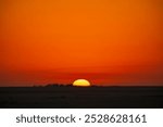 Sun is rising in the desert . Sunrise-sunset desert landscape photo. Gulf desert sunrise with Golden Light and Vast Sand Dunes.