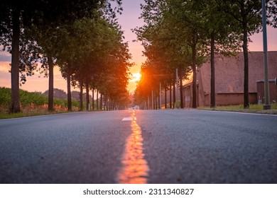 Sun Rising Over Asphalt Country Open Road In Sunny Morning Or Evening. Open Road In Europe In Summer Or Autumn Season At Sunny Sunset Or Sunrise Time. High quality photo - Shutterstock ID 2311340827