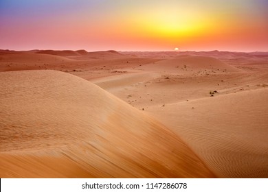 Sun Rising Over Dunes Of Dubai Desert Conservation Reserve, UAE