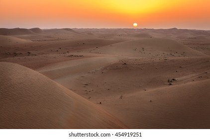 Sun Rising Over Dunes Of Dubai Desert Conservation Reserve, UAE