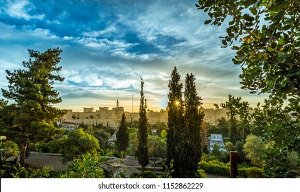 Sun Rising Over Jerusalem Walls And The Tower Of David, View The Mitchell Park Gardens