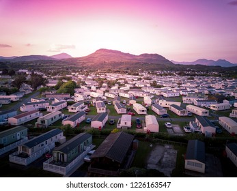 Sun set at a Caravan and camping park, static home aerial view. Porthmadog holiday park taken from the air by a drone
