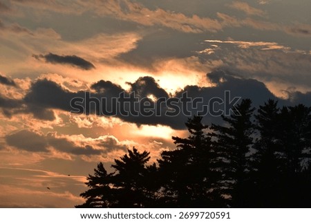 Sun set with ominous dark clouds