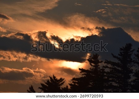 Sun set with ominous dark clouds