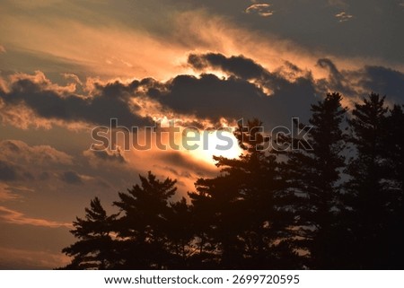 Sun set with ominous dark clouds