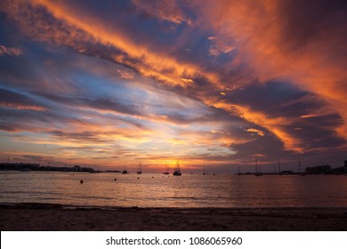 Sun set over San Antonio Bay Ibiza - Beautiful natural colours wave across the evening sky 